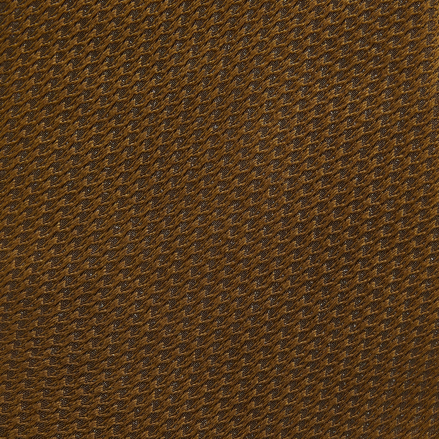 View 3 of product The Turnbull & Asser Plain Lace Jacquard Earth Tie, an essential brown wardrobe accessory, is shown rolled up against a plain white background.