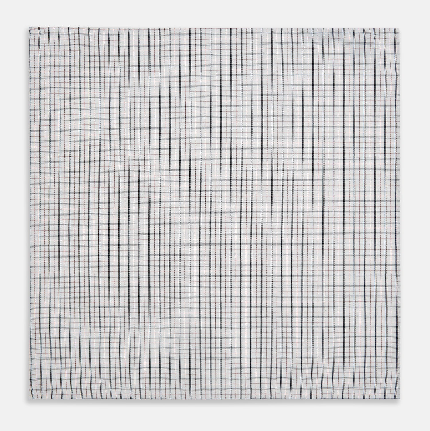 View 3 of product The Red Multi Graph Check Hand-Rolled Handkerchief by Turnbull & Asser features thin black, red, and blue lines forming small squares on white fabric, finished with delicate hand-rolled edges.
