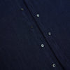 View 7 of product The Navy Linen Westminster Shirt by Turnbull & Asser features a classic collar and buttoned cuffs, exemplifying British craftsmanship. Shown here in long sleeves, the shirt is displayed flat against a white background.