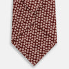 View 3 of product The Turnbull & Asser Burgundy Flower Patterned Silk Tie features a repeating white and light pink floral motif, shown against a plain white background.