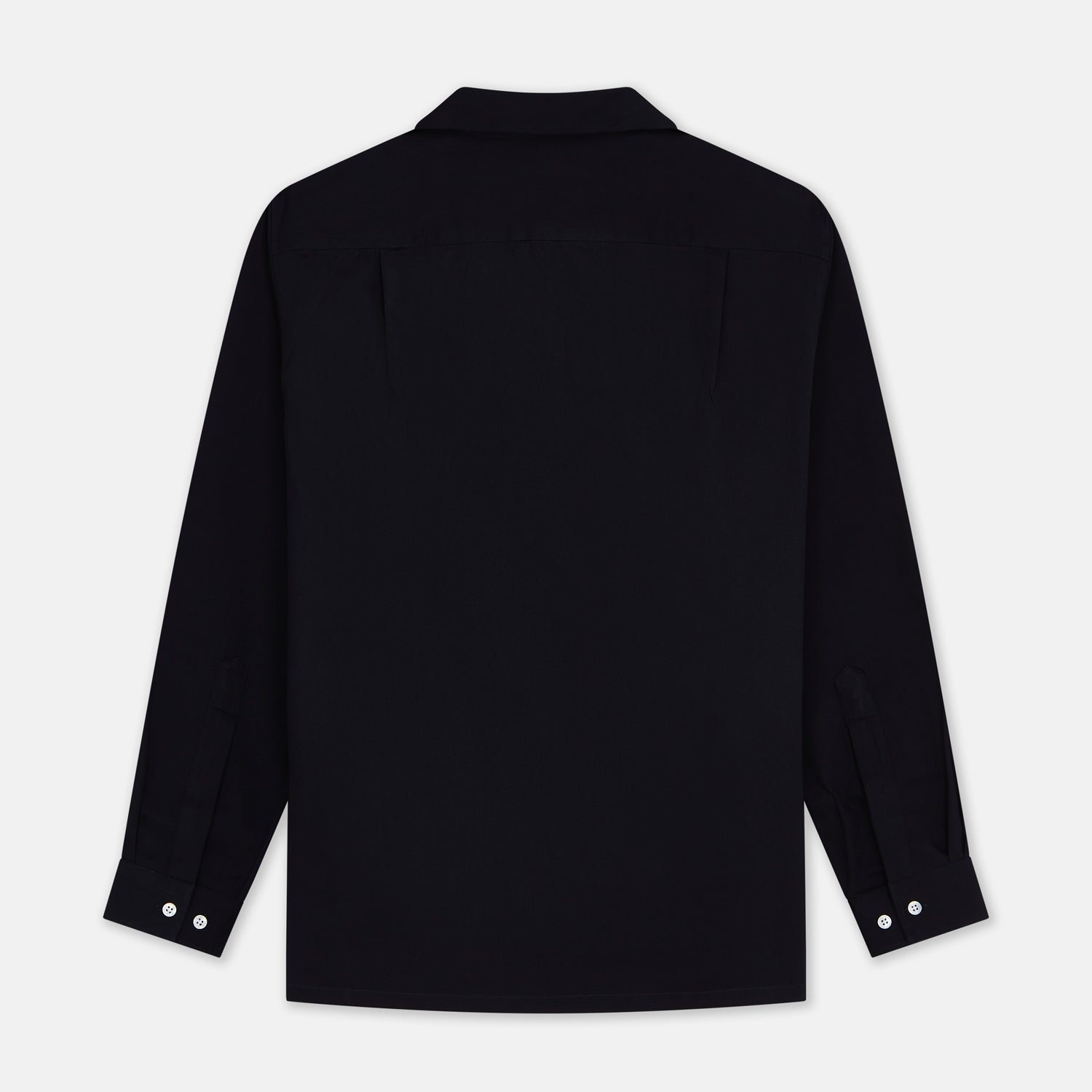 View 4 of product A Navy Cotton Holiday Fit Winnington Shirt by Turnbull & Asser, featuring long sleeves, a chest pocket, white buttons, and a revere collar, is laid flat on a white background.