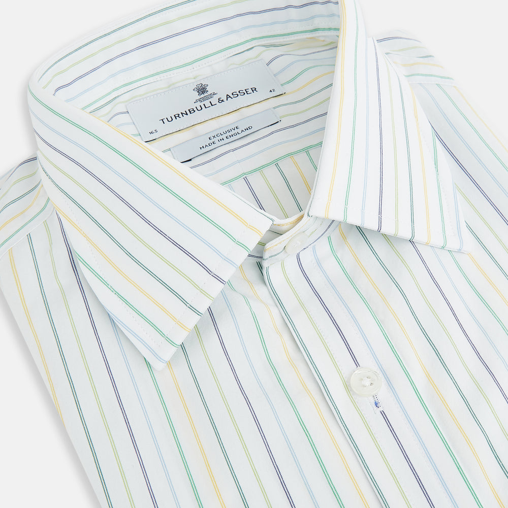 The Turnbull & Asser Multi Tone Double Pinstripe Mayfair Shirt is a long-sleeve pure cotton shirt with a collar and thin blue, green, and yellow double pinstripes on a white background.
