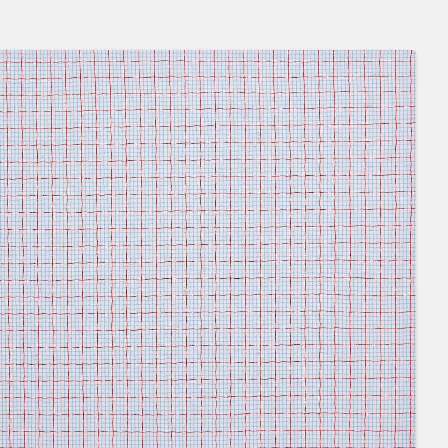 View 2 of product The Turnbull & Asser Hand Rolled Red Multi Graph Check Handkerchief features blue and red grid lines on white, with a red check forming larger squares and blue lines creating smaller squares within the design.
