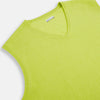 View 2 of product The Turnbull & Asser Lemon Green Cashmere V-Neck Vest boasts a modern knit design with a ribbed hem, shown on a plain white background—an ideal statement piece for gentlemen’s fashion.