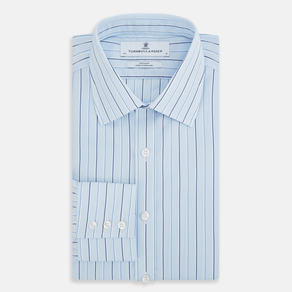 The Turnbull & Asser Navy and Blue Combination Stripe Mayfair Shirt, featuring thin vertical stripes and a classic collar, is displayed laid flat on a white background.