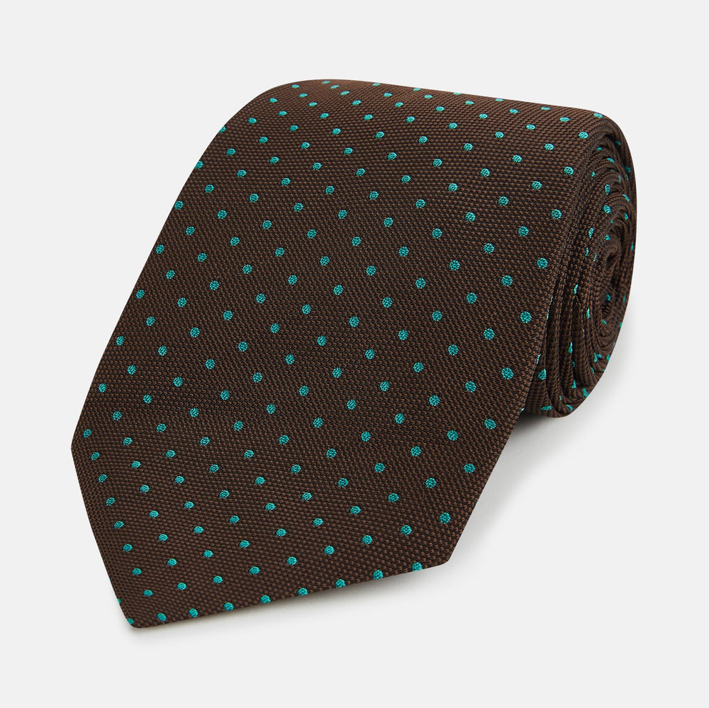 The Turnbull & Asser Green and Brown Micro Dot Silk Tie is shown rolled up, displaying its evenly spaced micro dot pattern against a plain white background.