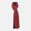 View 1 of product The Turnbull & Asser Plain Antique Pink Cashmere Knitted Scarf is neatly folded and knotted against a plain white background.