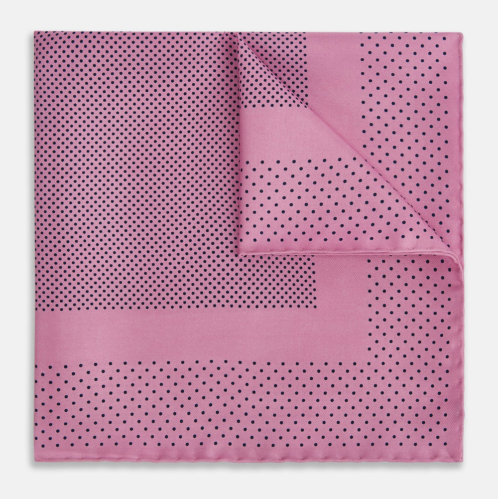 The Pink Dot Silk Pocket Square by Turnbull & Asser features pink silk with a border of small black dots, expertly handcrafted for a stylish touch to any suit. Fold to showcase both sides for added elegance.