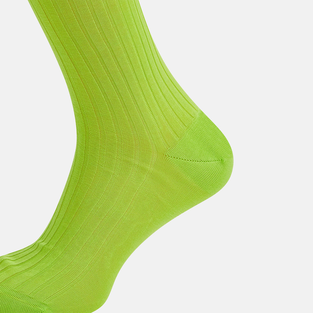 The Turnbull & Asser Lime Long Sock is a single bright green, knee-high sock with a ribbed texture, crafted from soft mercerised cotton, shown against a white background.