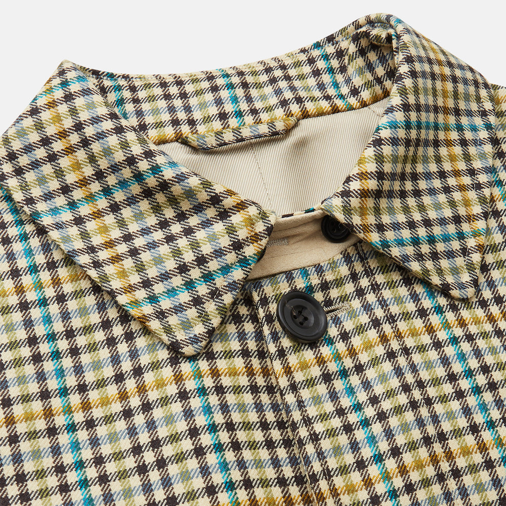 The Turnbull & Asser Green and Blue Multi Check Wool Elliot Coat is a men’s knee-length, long-sleeved overcoat with a collar and button-up front, crafted from Scottish wool in a check plaid pattern, shown on a white background.