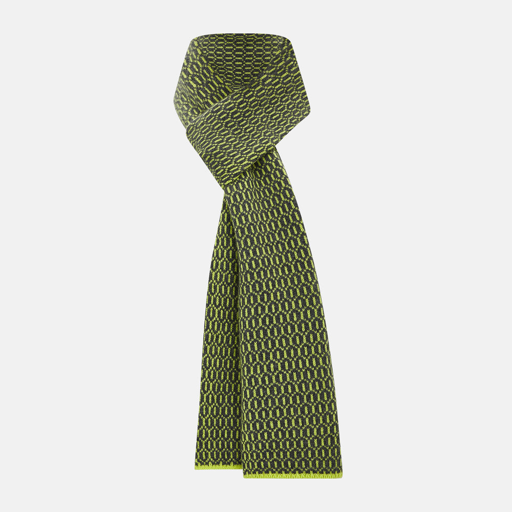 The Turnbull & Asser Graphite and Chartreuse Lemon Hexagon Cashmere Knitted Scarf features a geometric pattern in green and yellow tones, neatly folded to show both ends—an essential accessory with luxurious softness.