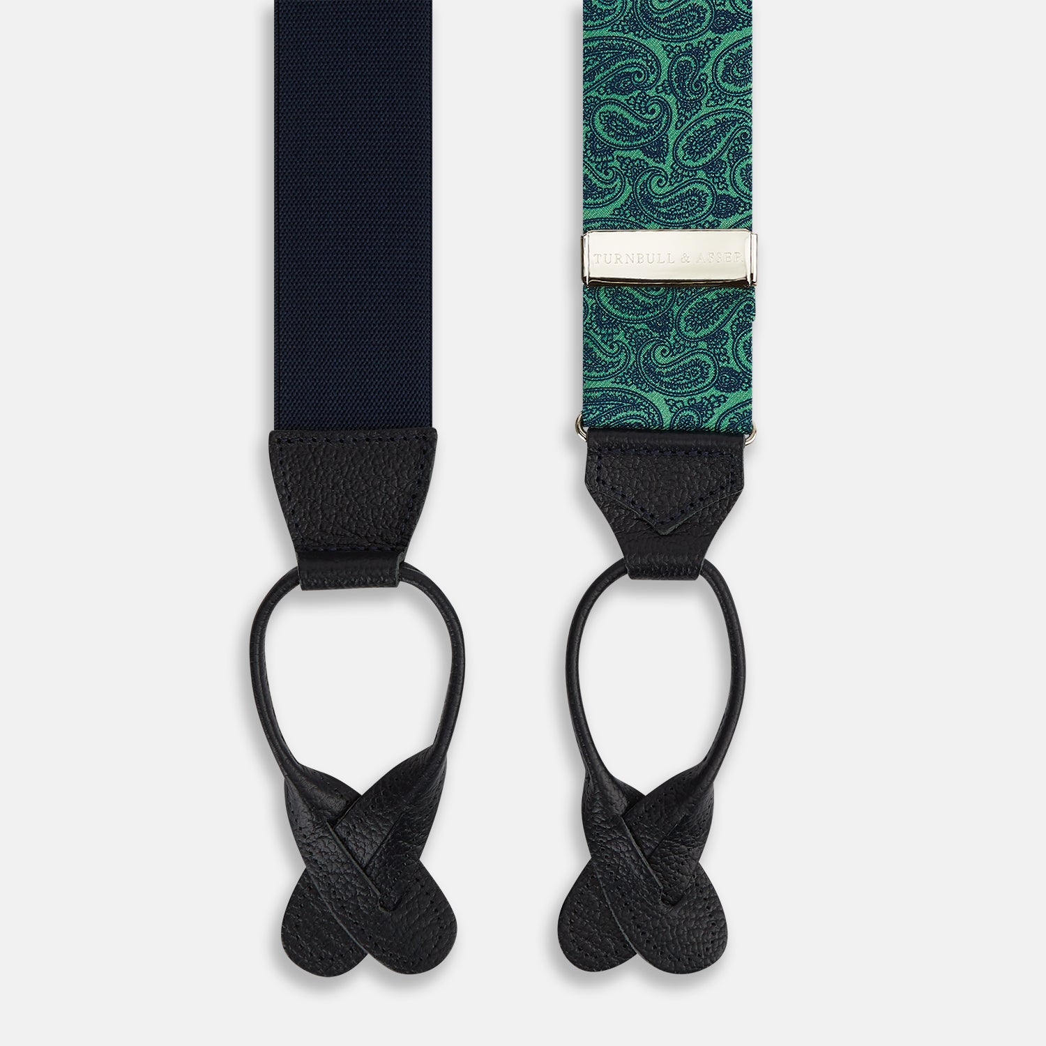View 2 of product Turnbull & Asser's Kelly Green Paisley Adjustable Silk and Navy Leather Braces feature a bold paisley pattern, adjustable fit, and navy leather detailing. Shown flat on a white background—ideal for refined, elegant styling.