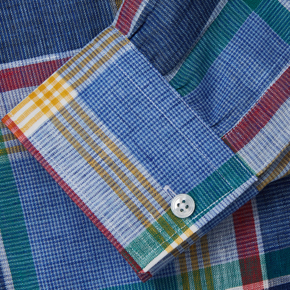 The Blue Multi Check Linen Weekend Fit Suffolk Shirt by Turnbull & Asser features a classic collar, white buttons, chest pocket, and colorful blue, green, yellow, red, and white plaid—perfect for a casual weekend look.