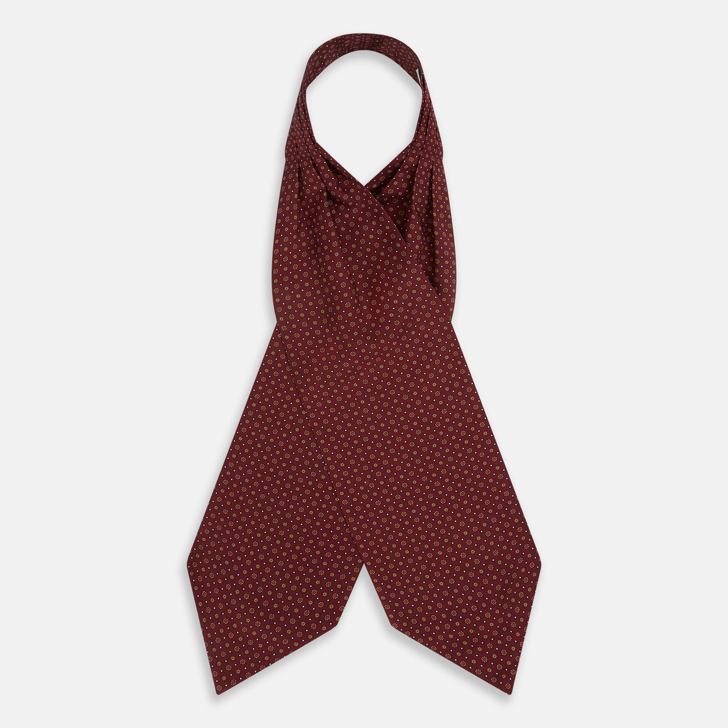 View 2 of product The Great Gatsby Burgundy Printed Silk Cravat by Turnbull & Asser features a maroon silk fabric with a small yellow and blue geometric pattern, subtle sheen, and neatly finished edges for an elegant, Gatsby-inspired formal accessory.