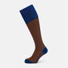 View 1 of product The Turnbull & Asser Royal Blue/Orange Thin Striped Long Sock is a knee-high, over-the-calf sock in mercerised Egyptian cotton, featuring vertical orange and dark blue stripes with blue cuff, heel, and toe. Displayed on a white background.