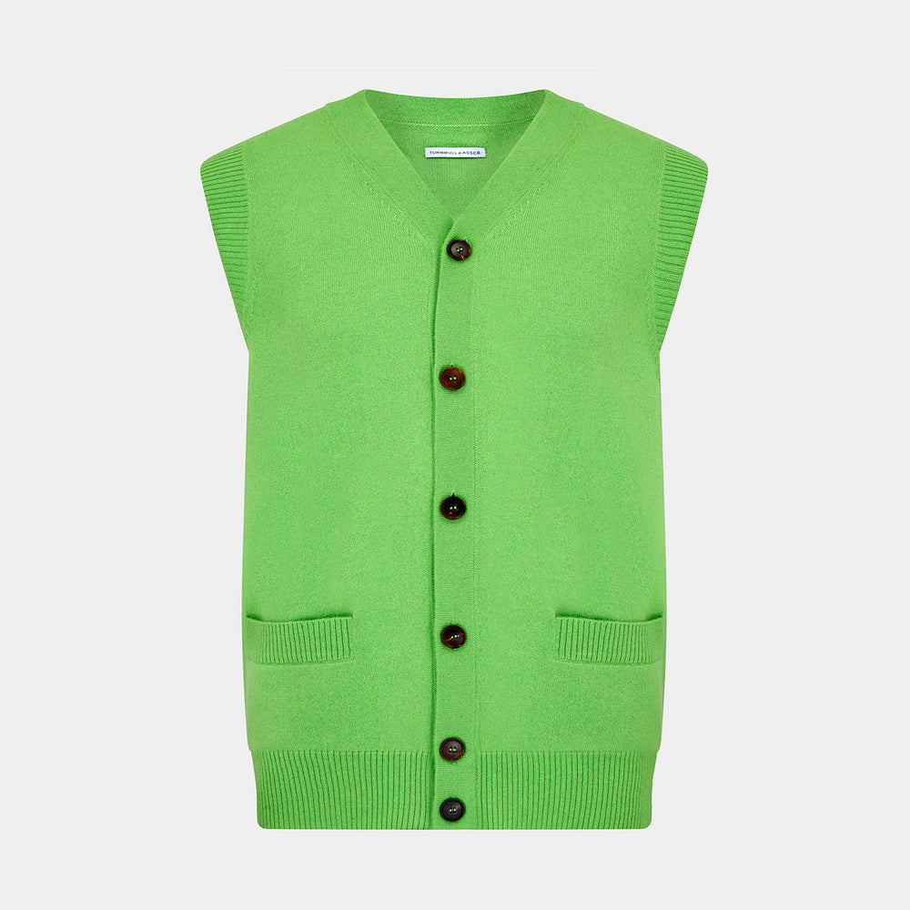 The Turnbull & Asser Lime Green Fine Merino V-Neck Sleeveless Cardigan features dark buttons, two front pockets, and a sophisticated look, all set against a plain white background.