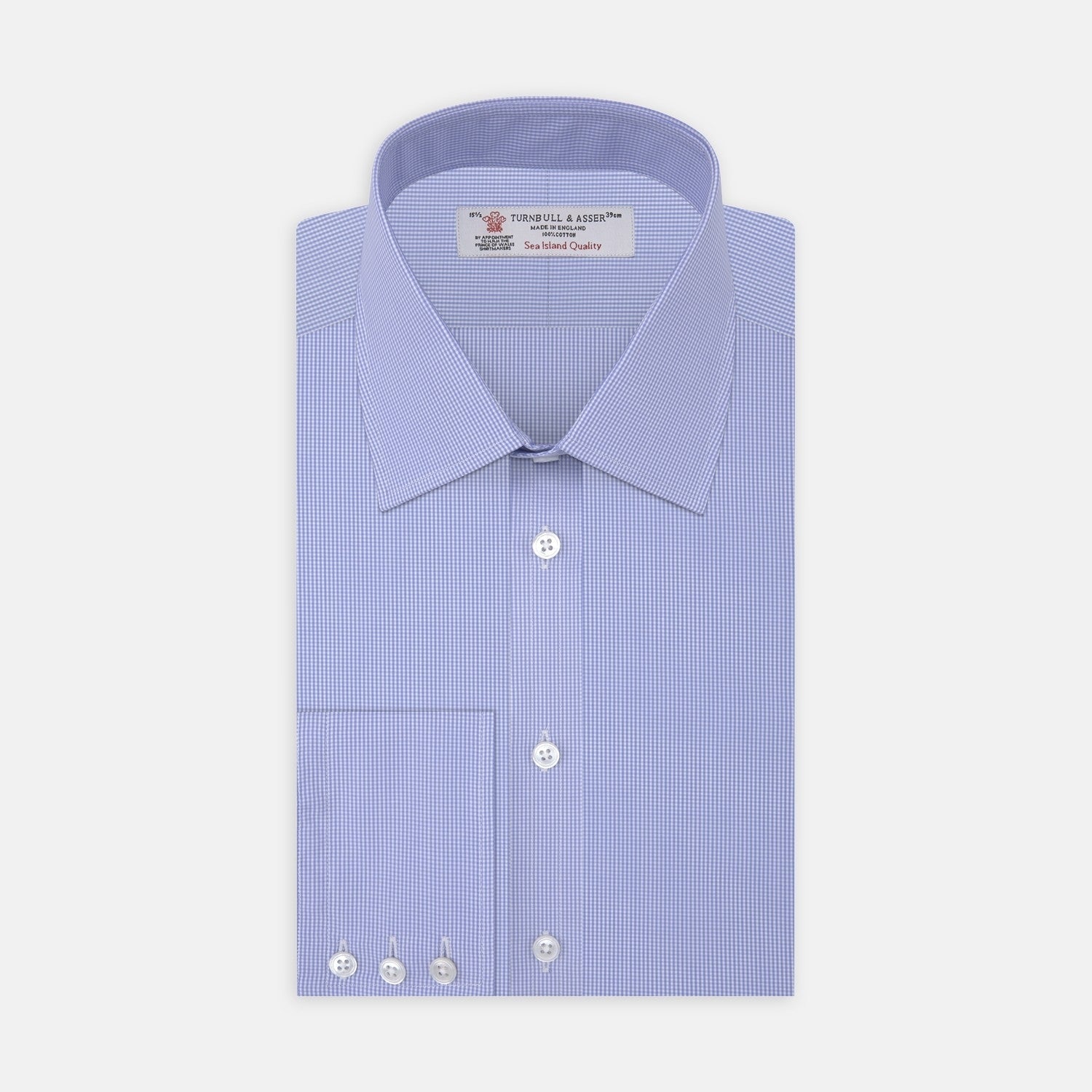 View 2 of product A close-up of Turnbull & Asser's Blue Fine Check Sea Island Quality Cotton Fabric, featuring a small light blue and white checkered pattern, shown as a circular swatch on a white background with a gray border.