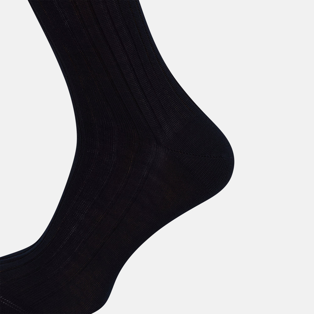 A single Midnight Thick Knit Mid-Length Sock by Turnbull & Asser, crafted from black mercerised Egyptian cotton, is shown in side profile against a plain white background with the toe pointing left.