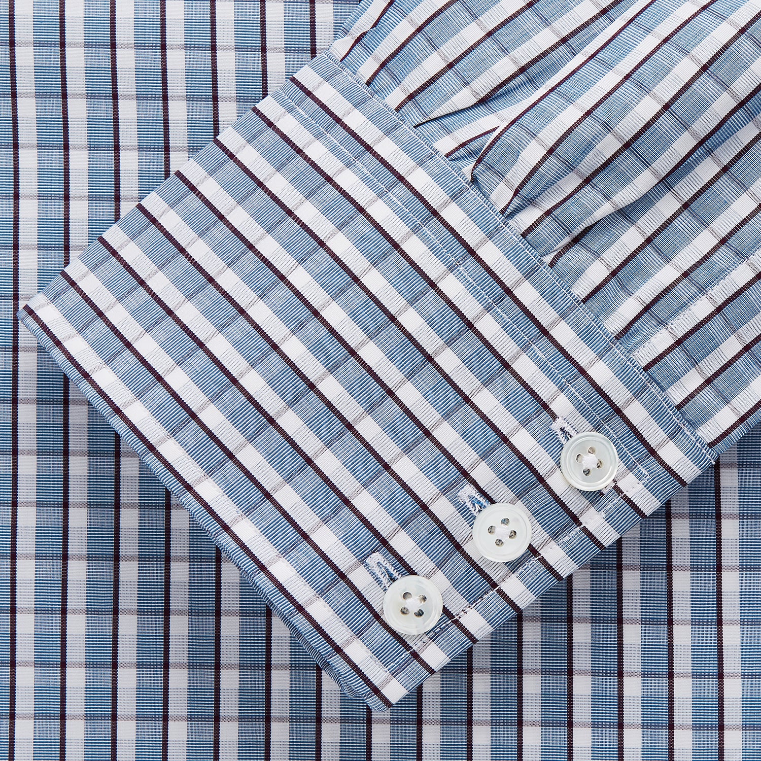 View 2 of product The Turnbull & Asser Blue and White Check Cotton Regular Fit Mayfair Shirt features long sleeves, a pointed collar, and buttoned cuffs, shown here on a white background.