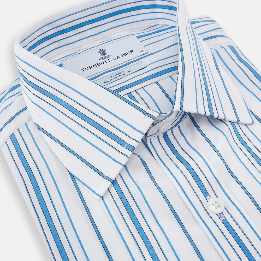 The Turnbull & Asser Blue Multi Stripe Mayfair Shirt features a T&A collar, vertical blue and white stripes, long sleeves, and a crisp Mayfair fit for a refined look.
