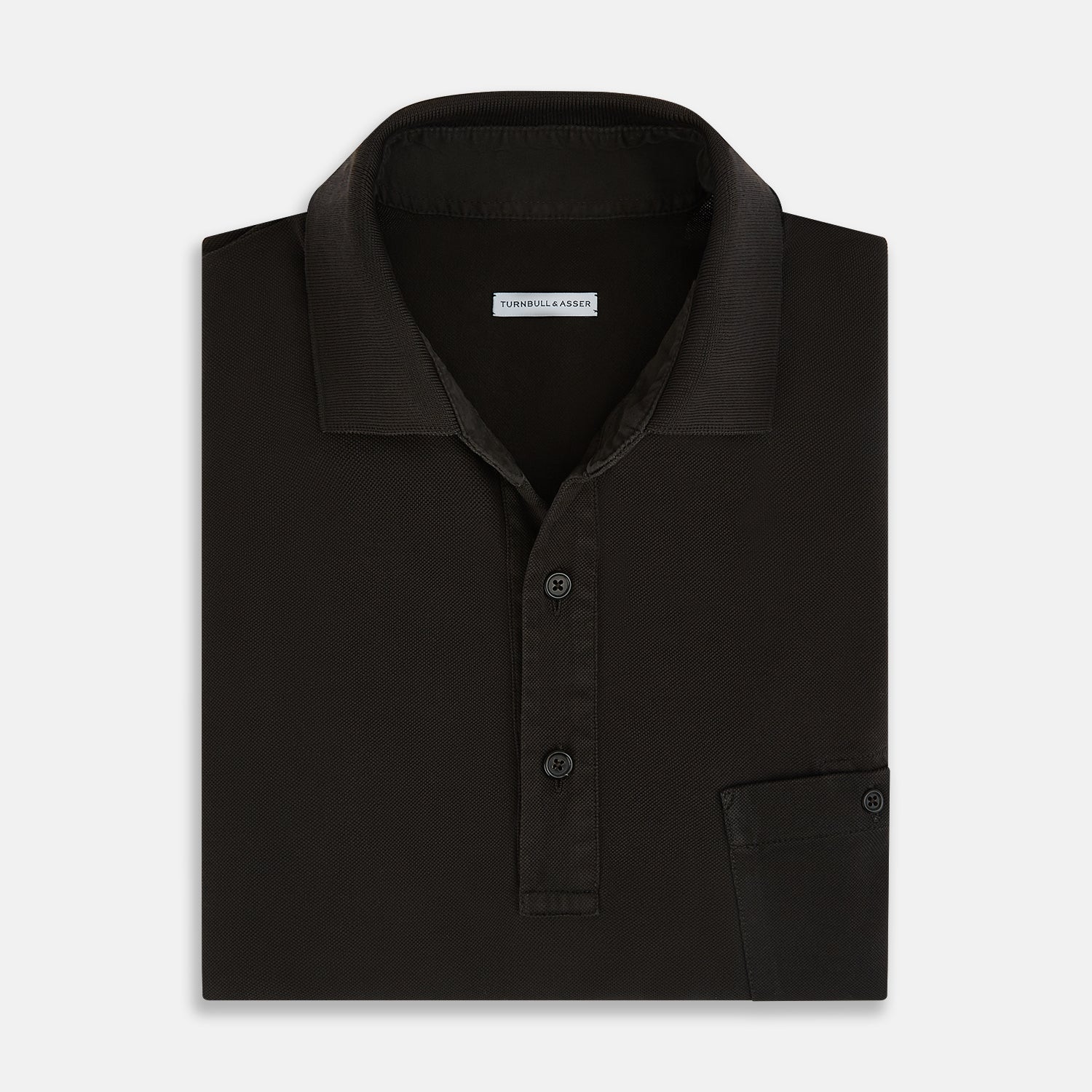 View 4 of product A brown cotton jersey polo shirt by Turnbull & Asser with short sleeves, a collar, three buttons, and a buttoned chest pocket, laid flat on a white background.