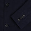 View 4 of product The Navy Knitted Oxford Blazer by Turnbull & Asser features notch lapels, two front buttons, a chest pocket, and two lower patch pockets, shown against a plain white background.