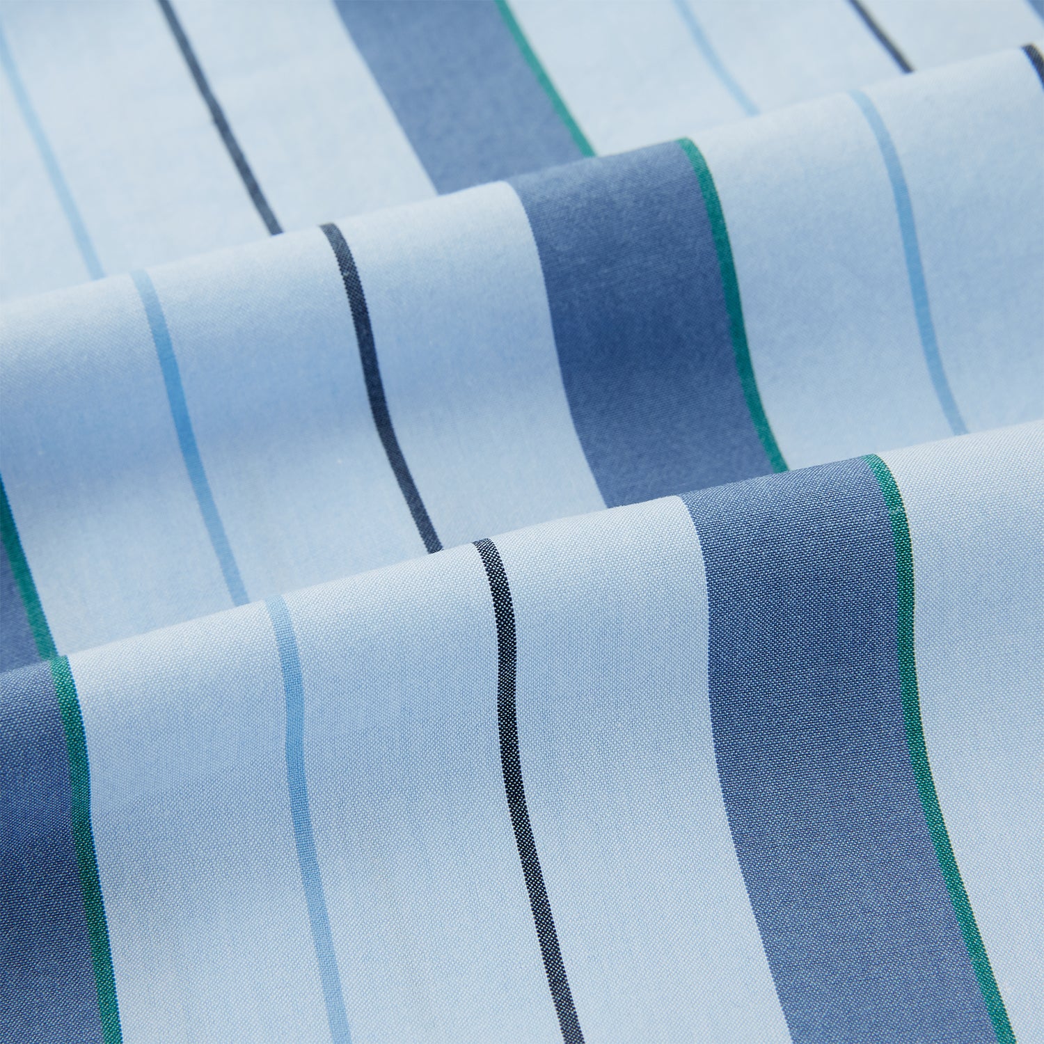 View 6 of product The Blue Baiadera Stripe Pyjama Shirt by Turnbull & Asser features long sleeves, a chest pocket, and a notched collar for an elegant nightwear look, shown on a white background.