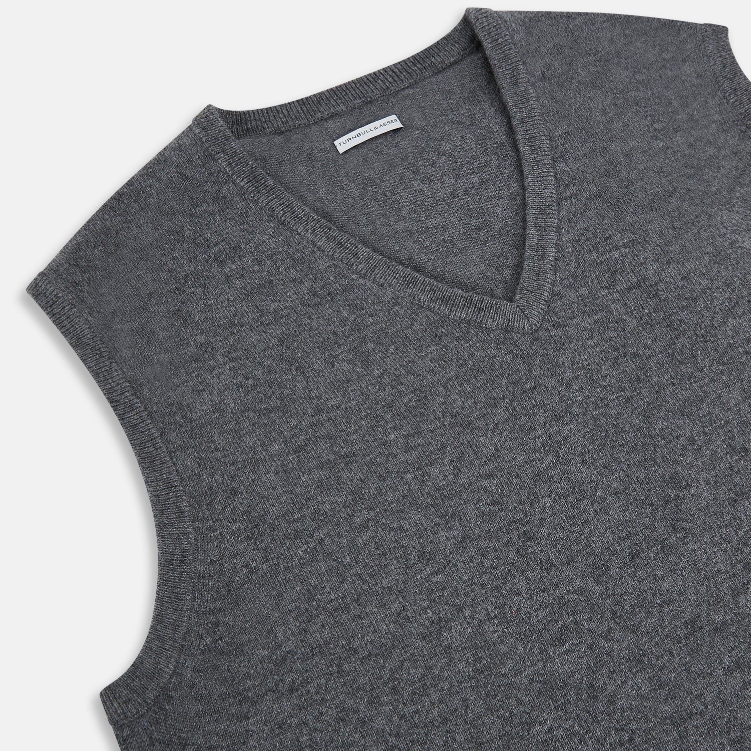 View 2 of product The Turnbull & Asser Slate Grey Melange V-neck Cashmere Vest is a plain, sleeveless jumper shown against a white background.