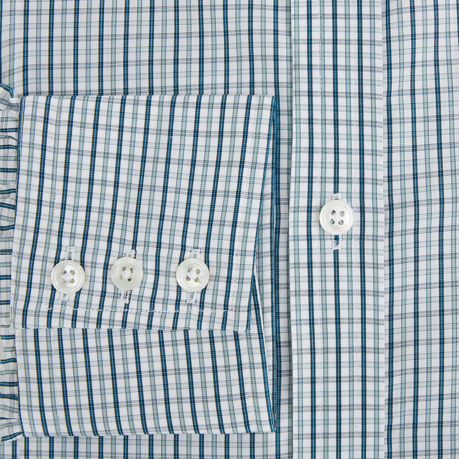 View 4 of product The Turnbull & Asser Light Petrol Micro Tattersall Check Mayfair Shirt features long sleeves, a classic collar, buttoned cuffs, and is crafted from Italian cotton in a refined blue and white check pattern.
