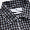 View 3 of product The Turnbull & Asser Black Multi Check Cotton Blend Sussex Nightshirt features a long sleeve, knee-length design with front buttons, a pointed collar, and chest pocket—ideal for those who love luxury sleepwear.
