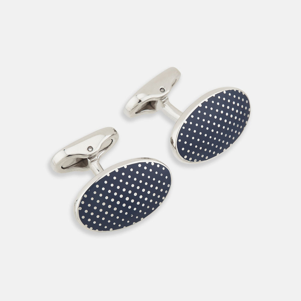 Turnbull & Asser's Navy Dotted Oval Cufflinks feature a silver finish and small white dots—ideal for adding a refined touch to any formal outfit. Shown here against a white background.
