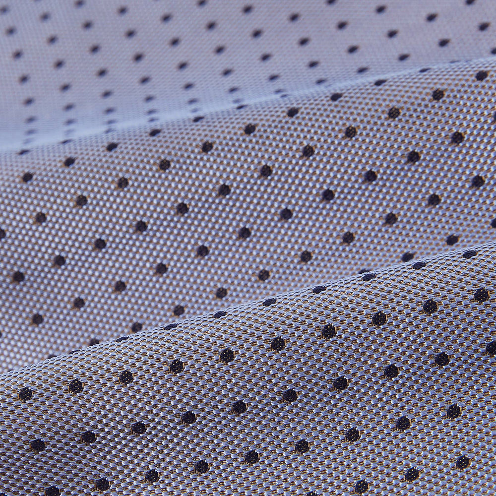 A light gray pocket square with small black polka dots pairs perfectly with the Turnbull & Asser Navy and Light Blue Micro Dot Silk Cravat for a refined, polished formal look.