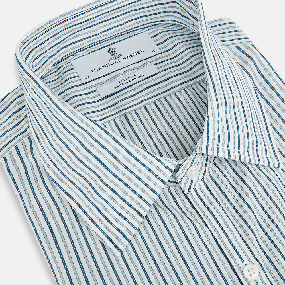 The GREEN DOUBLE STRIPE WESTMINSTER SHIRT by Turnbull & Asser features green and white vertical stripes, a pointed collar, buttoned cuffs, and a relaxed fit that highlights refined British craftsmanship.