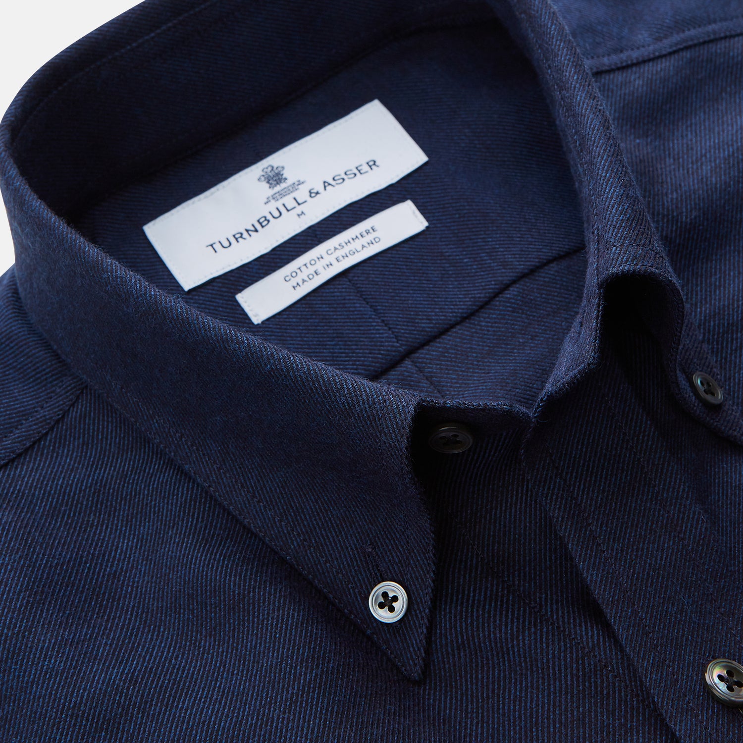 View 2 of product The Turnbull & Asser Navy Weekend Fit Nevis Cotton-Cashmere Shirt features a Dorset collar, button front, 1-button cuffs, and two button-flap chest pockets, shown laid flat on a white background.