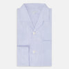 View 5 of product The Turnbull & Asser Pale Blue Hairline Stripe Pyjama Shirt features long sleeves and a single chest pocket, offering an elegant sleepwear style—shown on a plain white background.