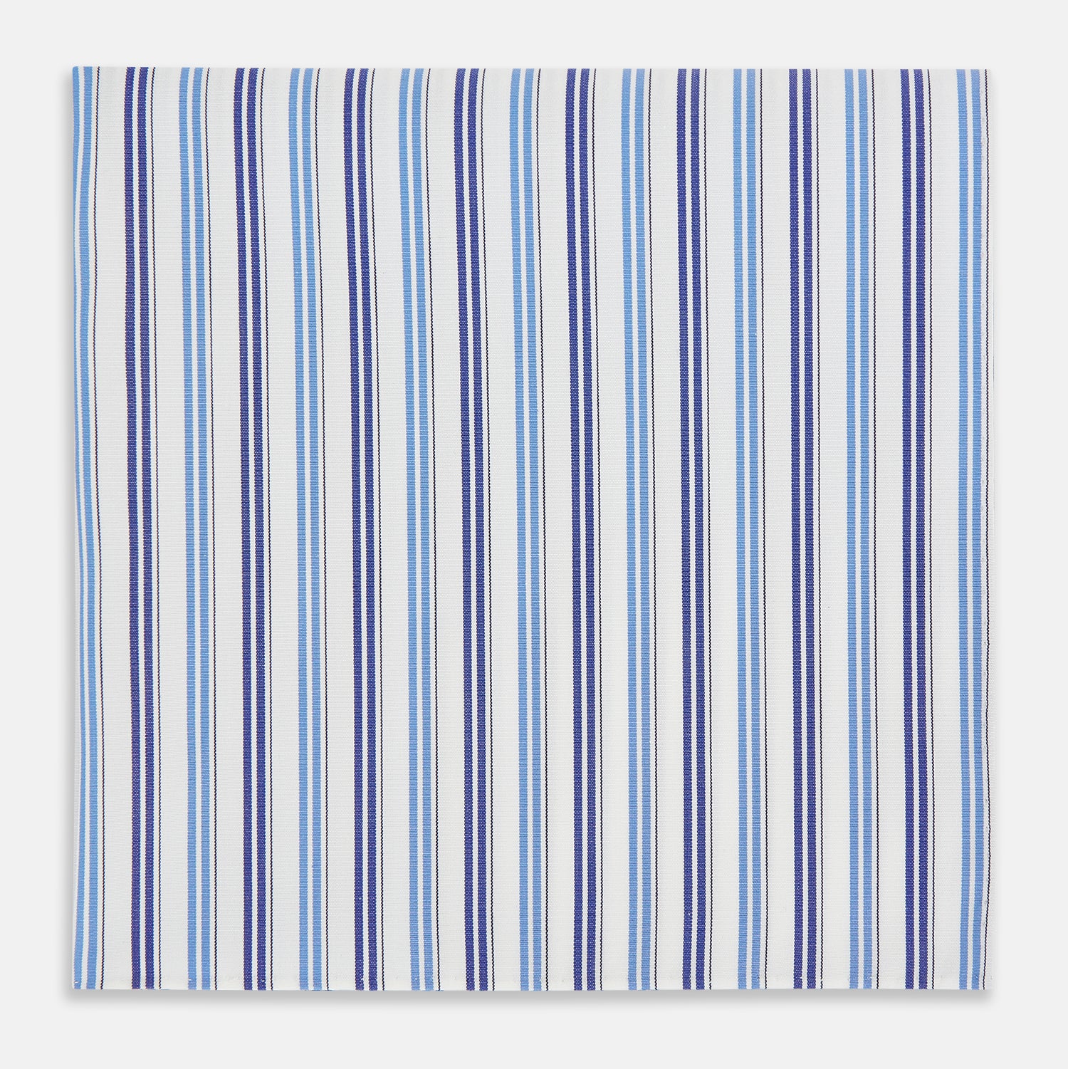 Image 1 of product The Blue and Navy Multi Stripe Hand-Rolled Handkerchief by Turnbull & Asser is crafted in England with a white background and evenly spaced vertical stripes in blue and navy.