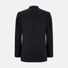 View 5 of product The Turnbull & Asser Short Navy Single Breasted Suit is shown flat on a white background, with a notch lapel jacket featuring two front pockets and matching trousers neatly folded underneath.