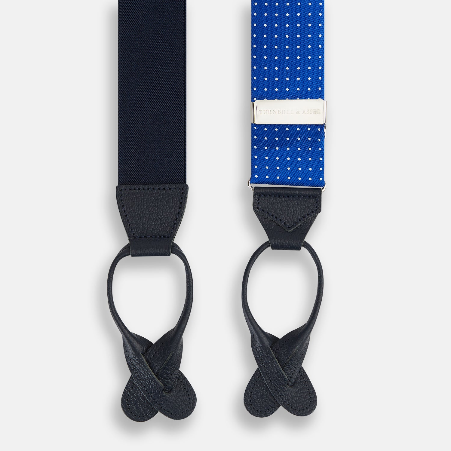View 2 of product Turnbull & Asser Pale Blue & White Small Spot Adjustable Silk and Navy Leather Braces, arranged in an M shape on a white background—a stylish, refined accessory for any formal wardrobe.
