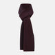 The Turnbull & Asser Navy and Burgundy Diamond-Patterned Cashmere Knitted Scarf, displayed upright on a plain white background, exudes sumptuous softness.