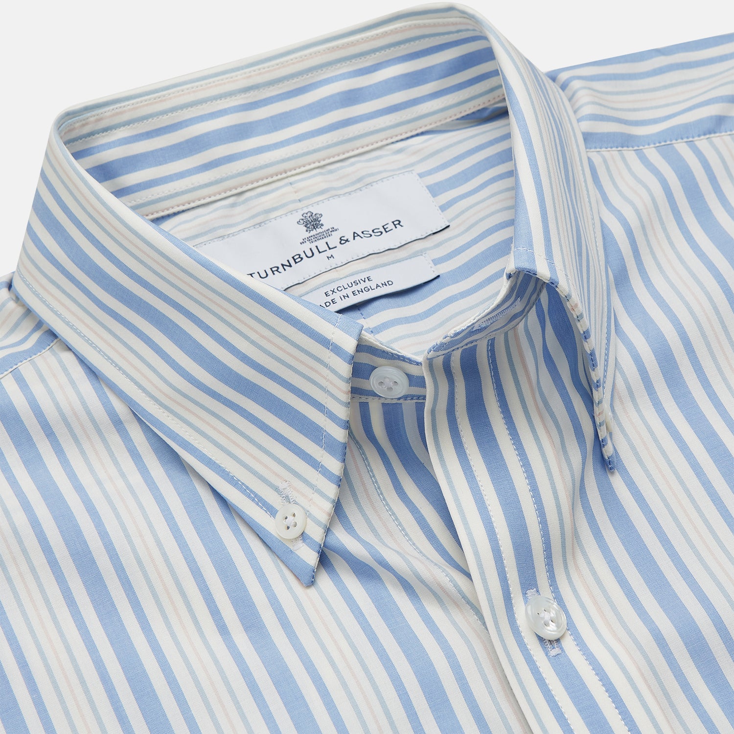 View 3 of product The Turnbull & Asser Blue Multi Stripe Wool Blend Weekend Fit Hayne Shirt features vertical blue, yellow, and white stripes, a button-down collar, and buttoned cuffs. Laid flat on a white background.