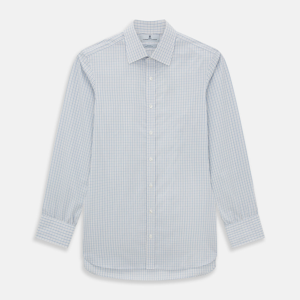 The Turnbull & Asser Sky Blue Combination Graph Check Mayfair Shirt features long sleeves, a pointed collar, buttoned cuffs, and a blue and white check pattern that showcases British craftsmanship. Displayed on a white background.