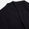 View 2 of product The Turnbull & Asser Long Navy Single Breasted Suit, shown on a white background, features a blazer with notch lapels and matching tailored trousers—ideal for formal occasions.
