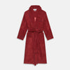 View 1 of product The Turnbull & Asser Burgundy Linen & Cotton Cord Gown, expertly made in England, features a shawl collar, patch pockets, and a matching fabric belt—shown here on a white background.