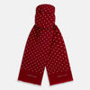 View 1 of product The Burgundy and White Spotted Silk Scarf by Turnbull & Asser features a gradient of white polka dots, short fringed edges, and the brand's name near the ends—a timeless classic foulard.