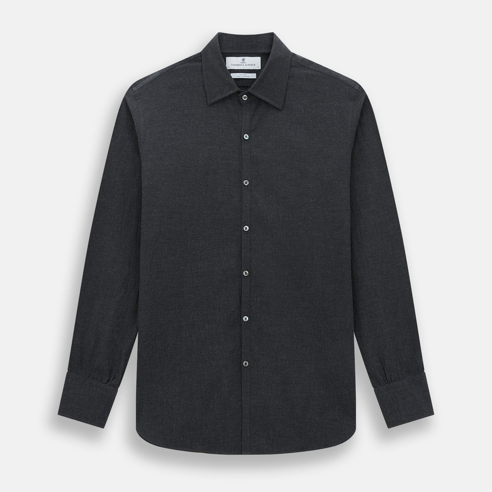 The Turnbull & Asser Midnight Blue Westminster Shirt features long sleeves, a button-up front, classic collar, and buttoned cuffs in a plain design—showcasing British craftsmanship—laid flat on a white background.