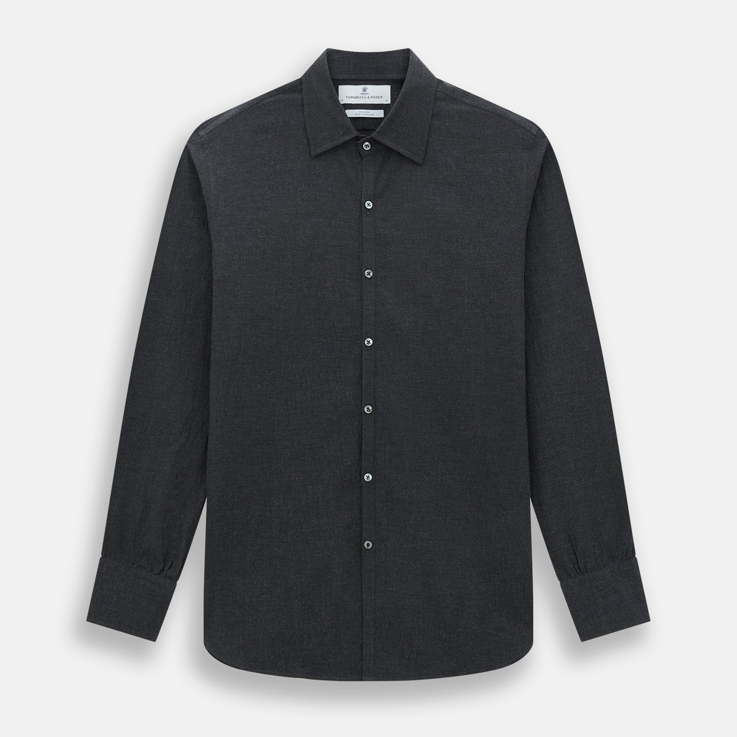View 1 of product The Turnbull & Asser Midnight Blue Westminster Shirt features long sleeves, a button-up front, classic collar, and buttoned cuffs in a plain design—showcasing British craftsmanship—laid flat on a white background.