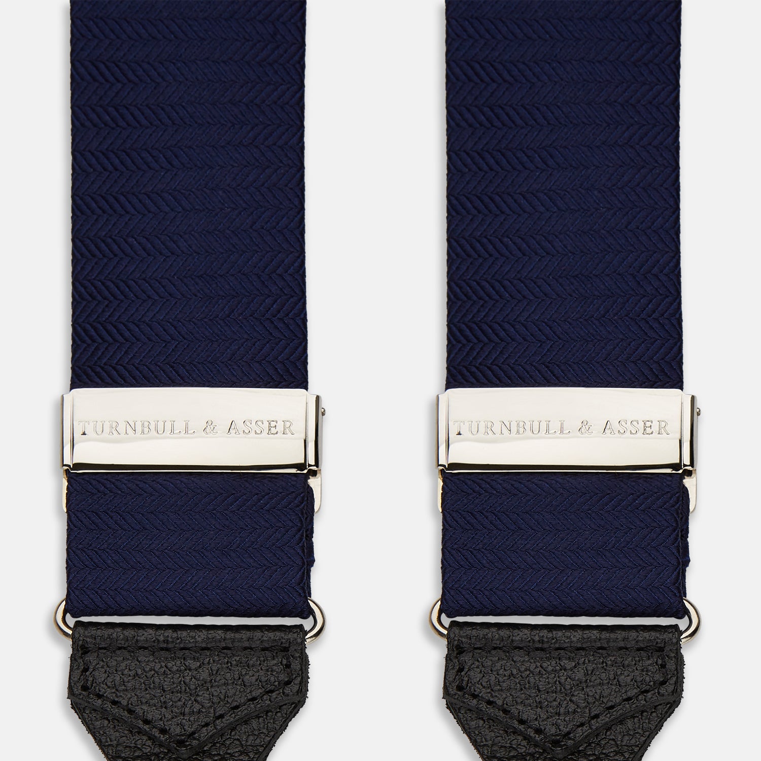 View 2 of product Turnbull & Asser Navy Silk Braces laid flat on a white background, featuring black leather loops, silver hardware, and an adjustable design.