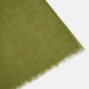 View 2 of product The Moss Green Cashmere Scarf by Turnbull & Asser features a lightweight, slightly sheer texture with subtle unfinished fringe ends. Loosely folded and draping elegantly, it’s a true luxury accessory set against a plain white background.
