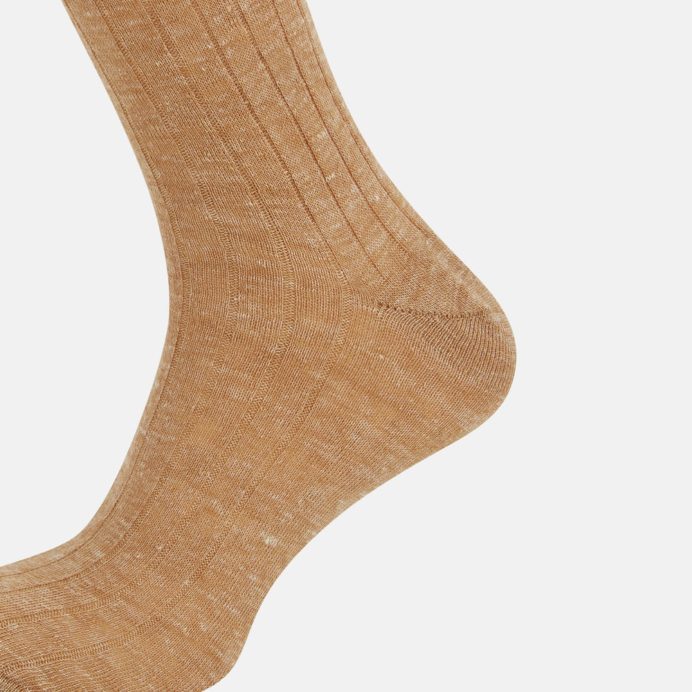 The Turnbull & Asser Rust Linen Mid-Length Sock is shown on a white background, featuring a ribbed texture for breathable comfort in everyday wear.