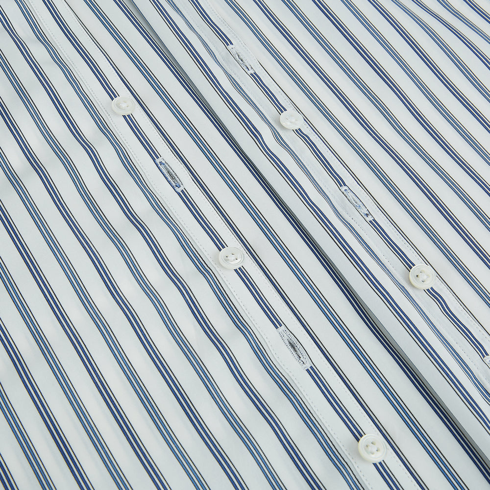 The Sapphire Blue Multi Track Stripe Westminster Shirt by Turnbull & Asser features a turnbull collar and vertical stripes, elegantly displayed flat against a white background—an ideal example of British craftsmanship.